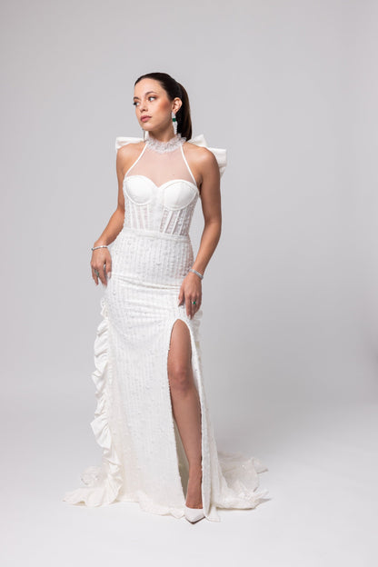 Off-white beaded Italian satin gown, halter jeweled neckline with large cascading double bow in the back.