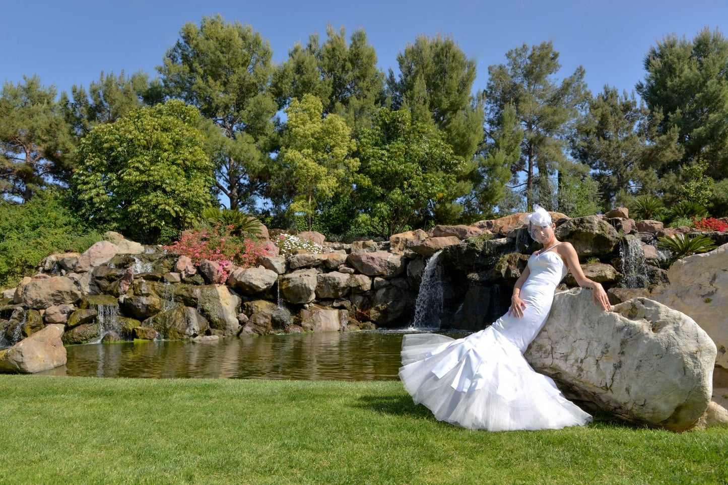 Chic halter gown with structured bust details and flared mermaid hemline with exposed tulle