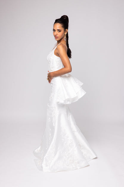 Off-white Mikado gown with embroidered lace, one shoulder with tulle detail over left bust.&nbsp; Detachable peplum.